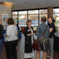 A group of guests mingle before the celebration